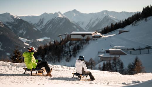 Couple tobogganing in the Rosskopf/Monte Cavallo Ski Area